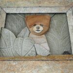 Cute Bear Carving on a Stone Tile